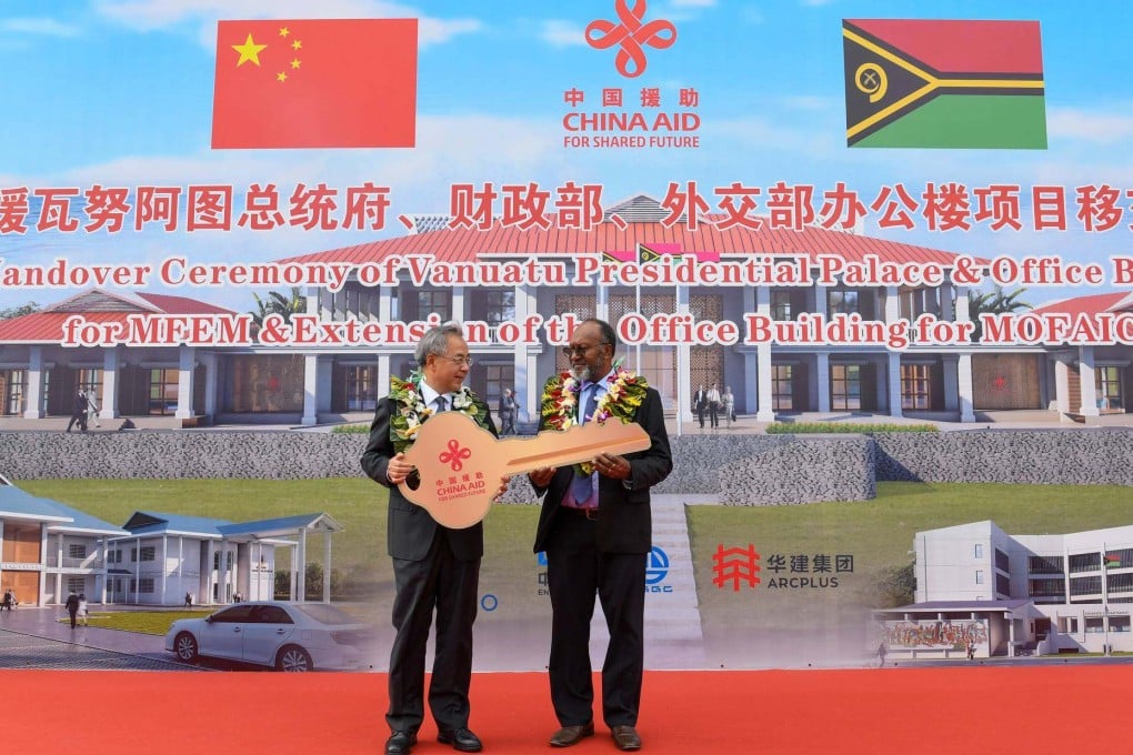 Vanuatu Prime Minister Charlot Salwai receives an oversized novelty golden key to the Pacific nation’s new China-funded presidential palace. Photo: Handout