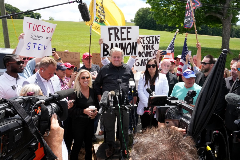 Steve Bannon, centre, speaks to the media as he reports to prison in Danbury, Connecticut, US on Monday. Photo: EPA-EFE