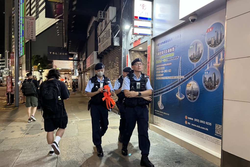 Police officers patrol the streets around Sogo on Monday evening. Photo: Emily Hung