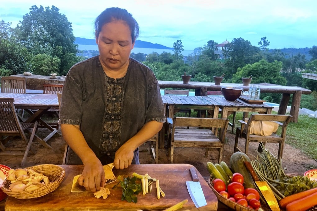 Lin Rattana chops ingredients at her Jungle Kitchen cooking school in Koh Samui, Thailand, where she shows guests how to cook authentic Thai food. Photo: Kylie Knott