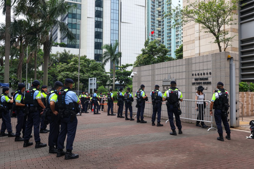 Police officers stand guard outside West Kowloon Court amid legal proceedings. Photo: Yik Yeung-man