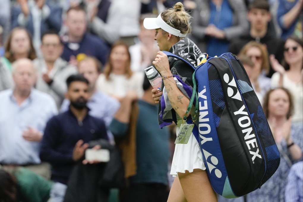 Defending Wimbledon champion Marketa Vondrousova leaves the Centre Court after being eliminated in the first round. Photo: AP