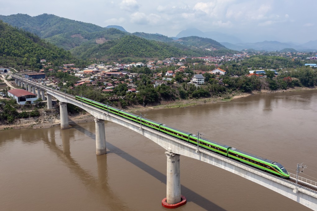 A train travels across the Mekong river on a bridge of the China-Laos Railway, which cost the landlocked country about US$6 billion. Photo: Xinhua