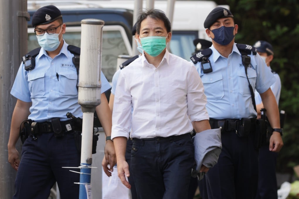 Former Democratic Party chairman Wu Chi-wai, who was on remand at the time, is escorted to his father’s funeral in 2021. Photo: May Tse