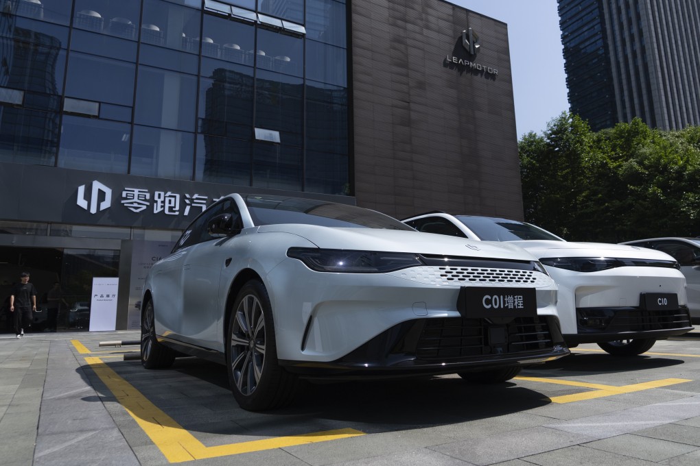 Electric vehicles are parked outside a showroom in Hangzhou, eastern China’s Zhejiang province. Photo: AP