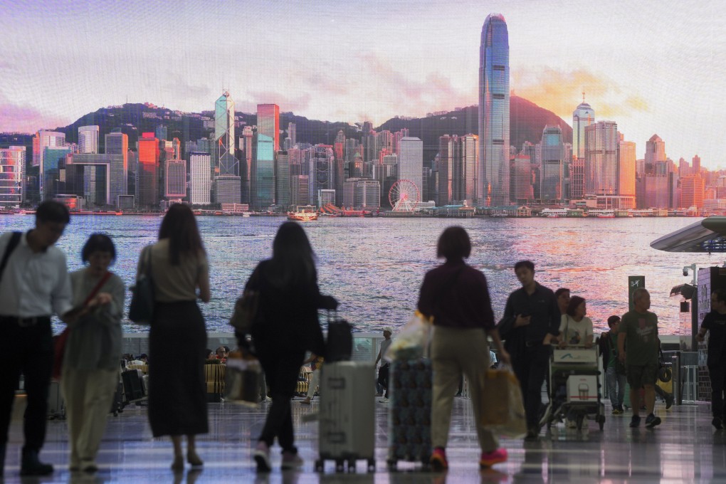 A giant monitor shows a view of Hong Kong in the Departure Hall at Hong Kong International Airport on June 18, 2024. Photo: Sam Tsang