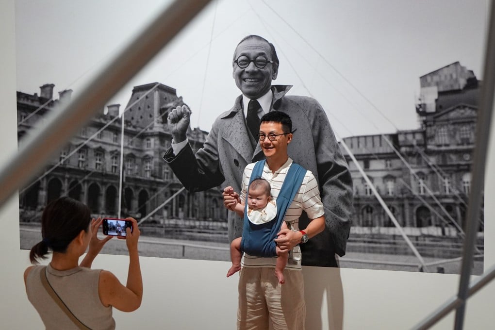 A family poses for photos at the M+ exhibition of the life and works of I. M. Pei, on June 29. The celebrated architect’s convictions are needed more than ever, if we are to find optimism in these divided times. Photo: Eugene Lee