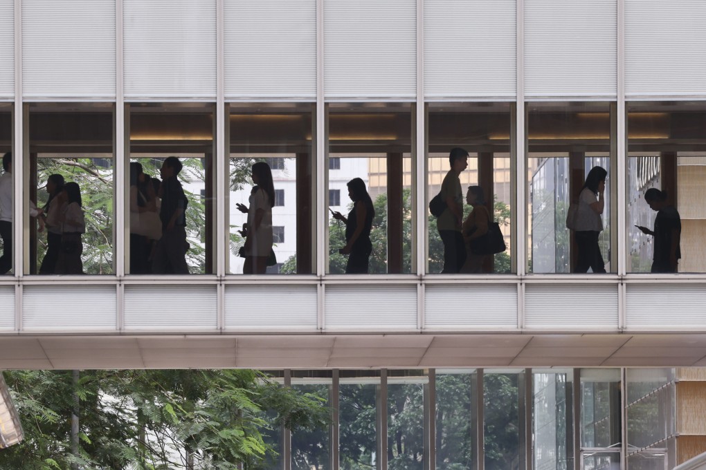 People cross a footbridge in Central, Hong Kong, during lunch time on June 18, 2024. Photo: Jelly Tse