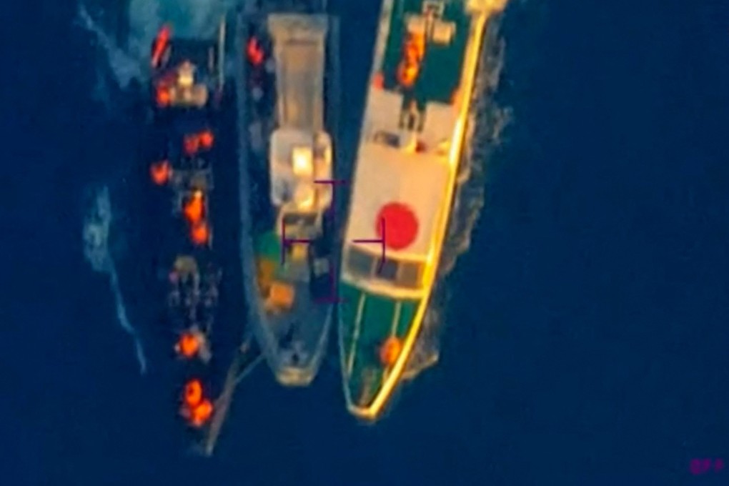 A Philippine boat between two Chinese coastguard vessels during an incident off Second Thomas Shoal in the disputed South China Sea on June 17. Photo: AFP