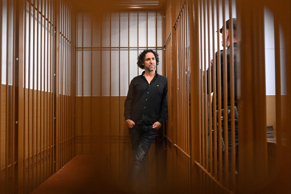 Laurent Vinatier, a French national who works with a Swiss-based conflict mediation non-profit organisation, stands inside the defendant’s cage during his pre-trial detention hearing in Moscow. Photo: AFP