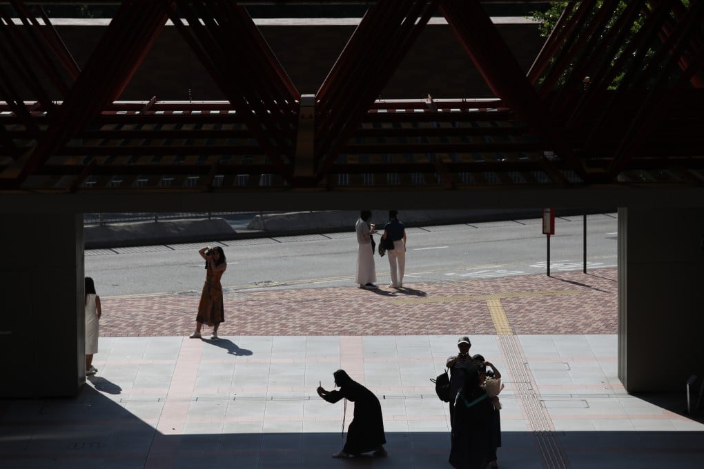 People take photos at Polytechnic University during graduation season. Photo: Xiaomei Chen