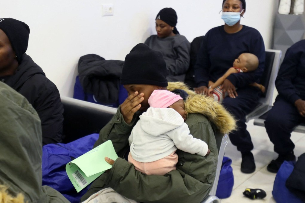 Irregular Nigerian migrants are given documents prior to their June departure from Libya’s anti-migration bureau, which is tasked with coordinating deportations of foreigners in the country illegally. Photo: AFP