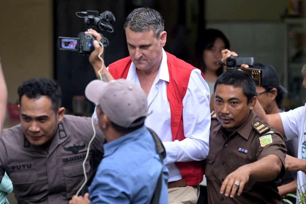 Troy Andrew Smith (centre) arrives at a courtroom to attend his trial in Denpasar, Bali, on July 4. Photo: AFP