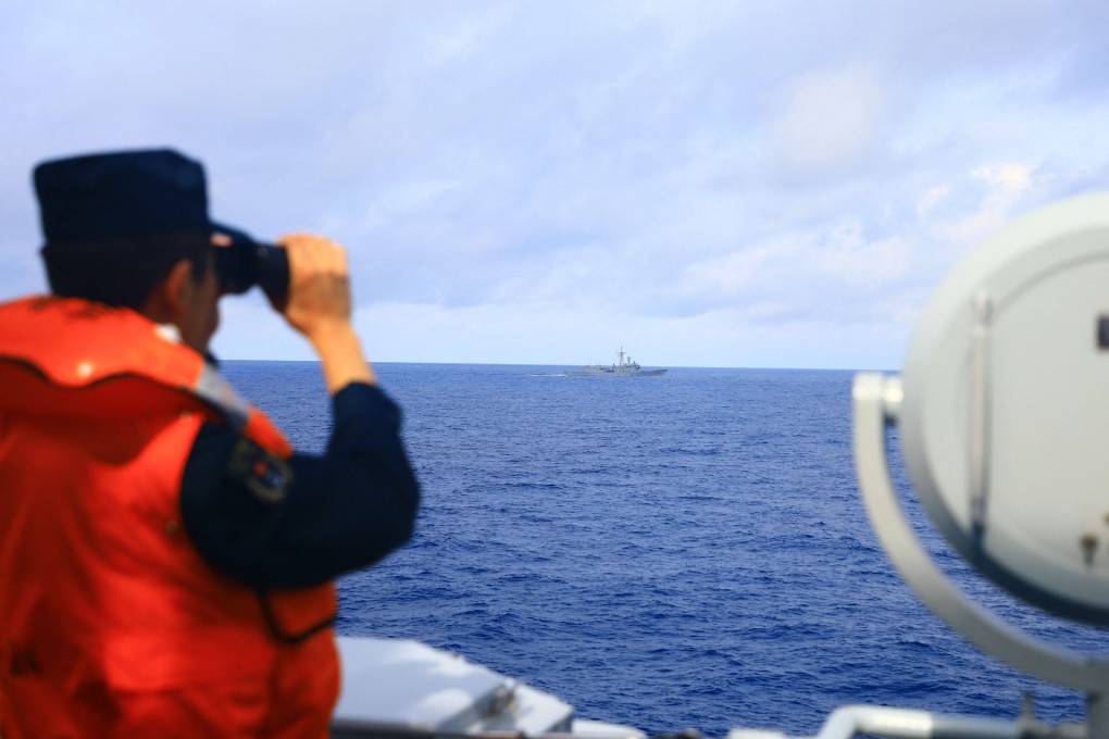 A People’s Liberation Army soldier uses binoculars to watch the sea during the Joint Sword-2024A military drill at an unknown location on May 23. Photo: AFP/PLA Eastern Theatre Command
