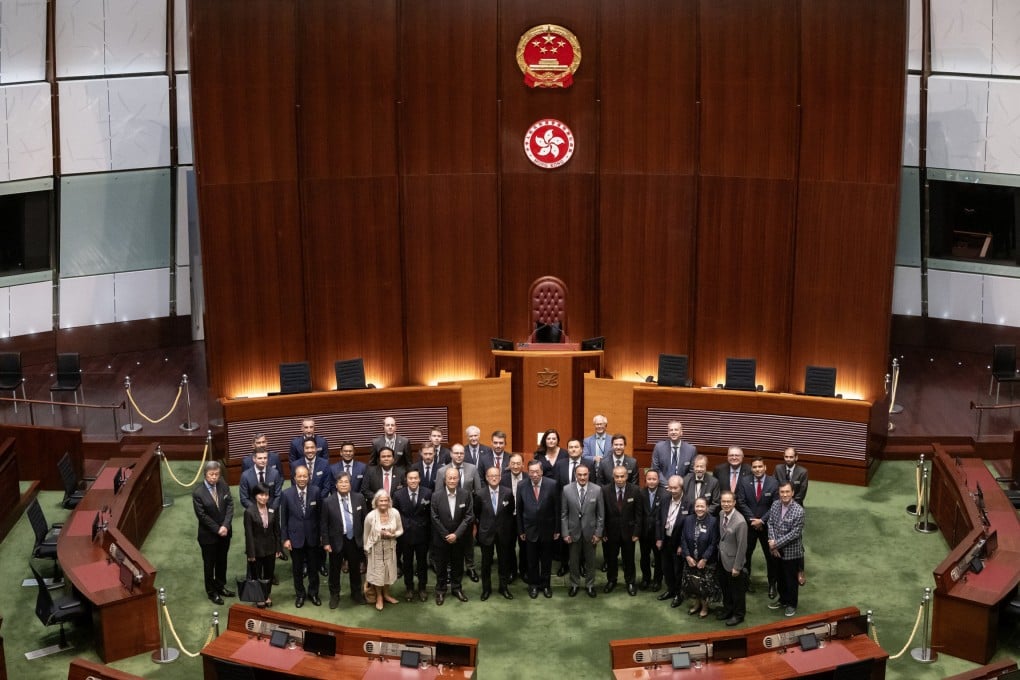 Legco president Andrew Leung (front row, centre) joins foreign diplomats for a group photo in the chamber. Photo: Legco