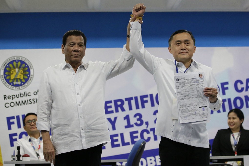 Former Philippine president Rodrigo Duterte (left) with his aide Christopher Lawrence Go in Manila. Photo: AP