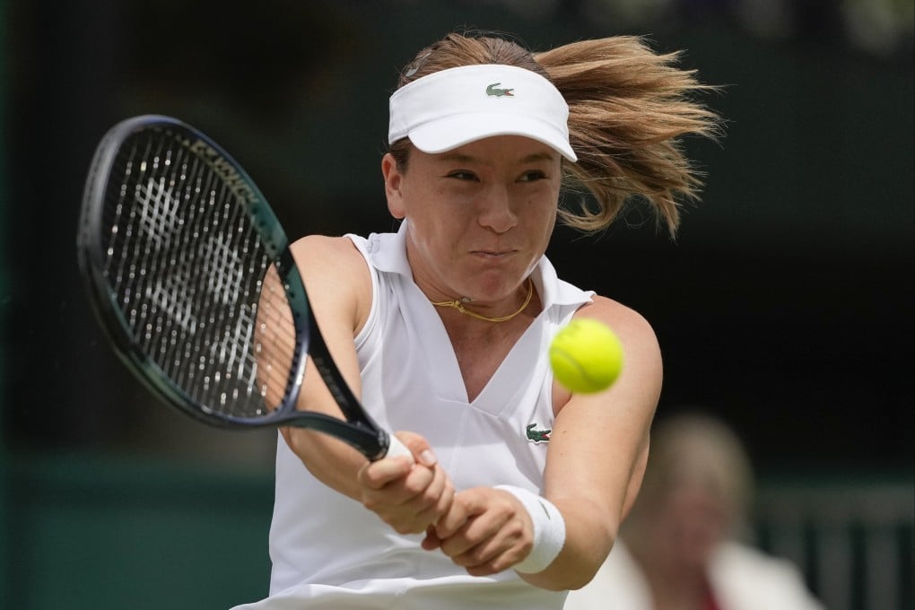 Lulu Sun plays a backhand return to Lin Zhu during their third round women’s singles match at Wimbledon. Photo: AP
