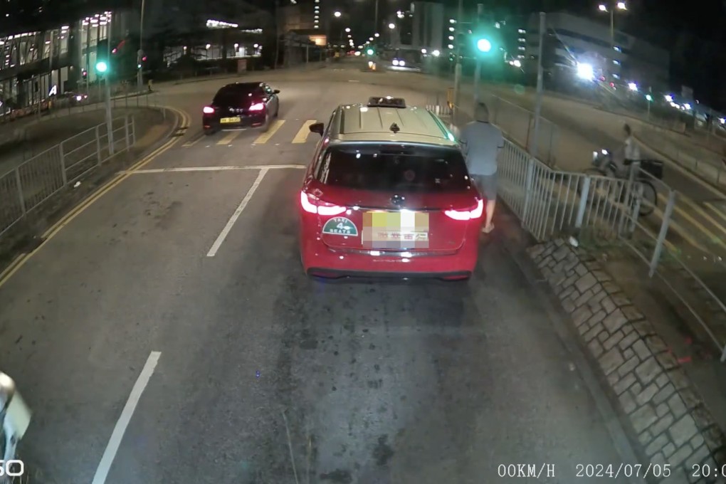 The video, published on Friday night, shows a cabby allegedly urinating after the taxi stopped at a traffic light. Photo: Facebook/Wai Sai Ng