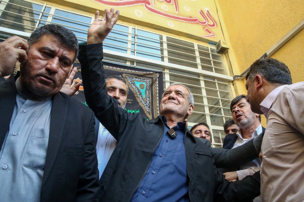 Iranian presidential candidate Masoud Pezeshkian waves at the crowd in Tehran on July 5. Photo: WANN via Reuters