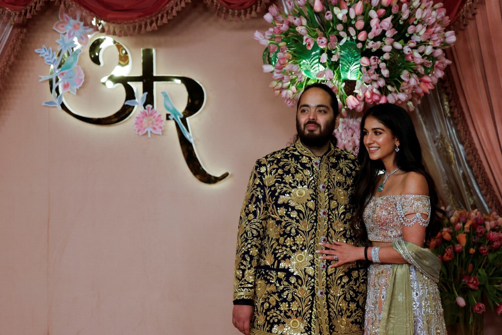 Anant Ambani with his fiancée Radhika Merchant during a ceremony in Mumbai on July 5. Photo: Reuters