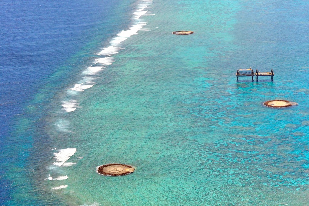 Okinotorishima is largely submerged at high tide, with only two small islets measuring just 9.4 square metres remaining above the water line – and even those were built up with concrete by Japan. Photo: Asahi Shimbun/Getty Images