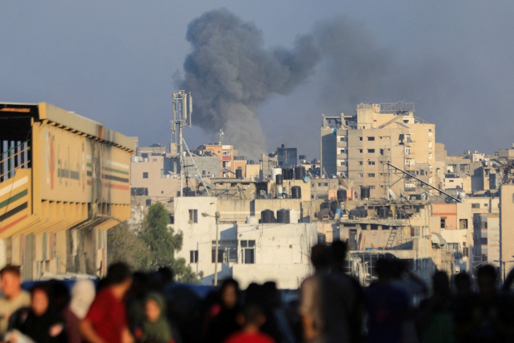 Smoke rises during an Israeli air strike in Gaza City on Sunday. Photo: Reuters