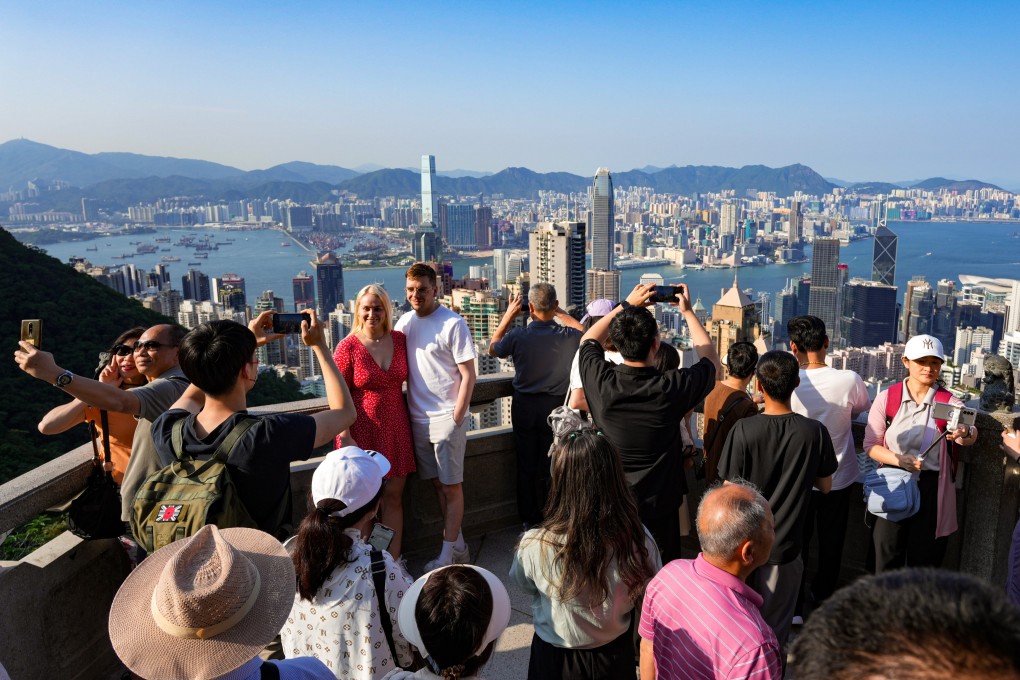 Visitors to The Peak enjoying views of Hong Kong Island and the Kowloon peninsula. Photo: May Tse