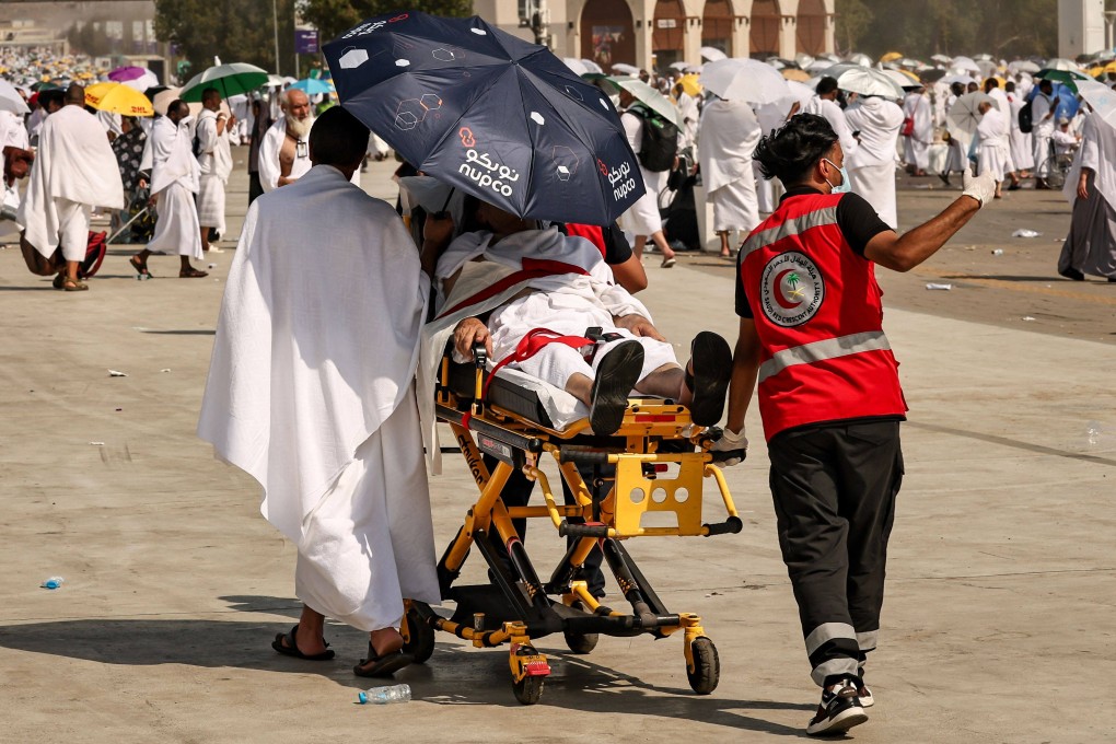Medics evacuate a pilgrim affected by scorching heat at the base of Mount Arafat during the annual haj on June 15. Saudi Arabia has said more than 1,300 faithful died during the pilgrimage. Photo: AFP
