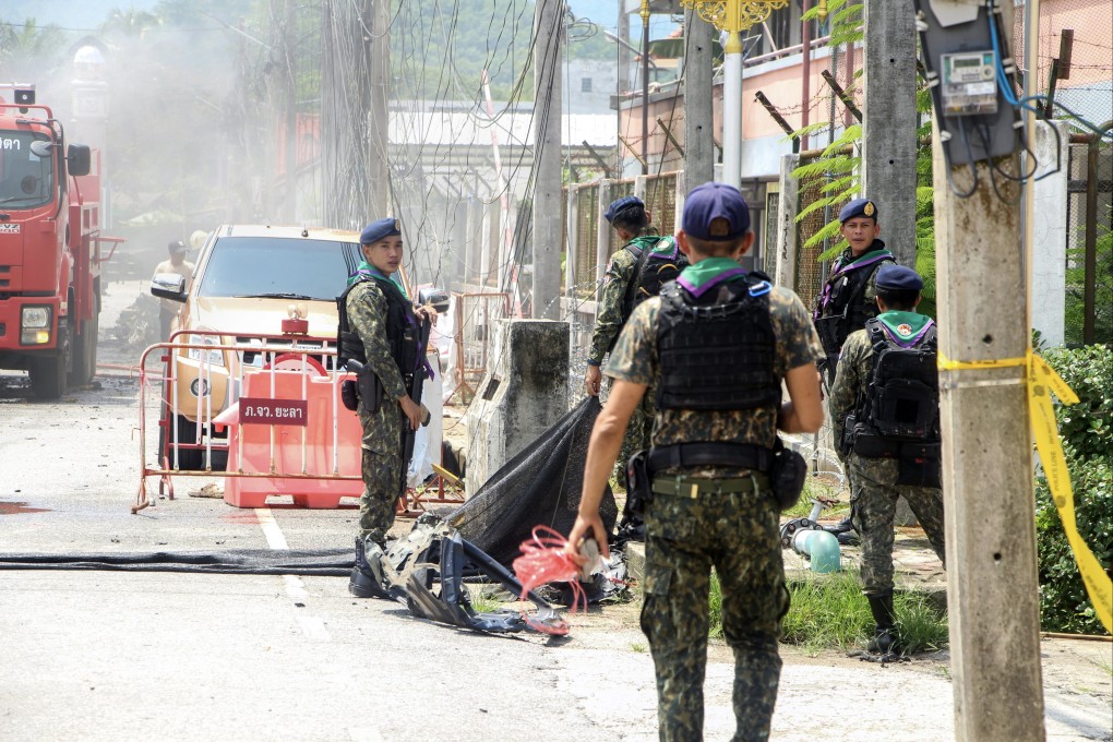 Thai soldiers in the area of a bomb blast scene after a car exploded in front of a police flat in Bannang Sata district, Yala province, southern Thailand, on June 30. Photo: EPA-EFE