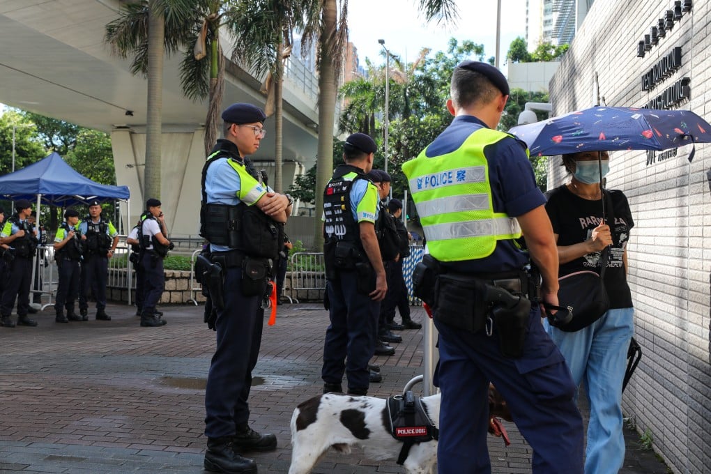 Hong Kong police at West Kowloon Court amid the city’s largest national security trial. Photo: Xiaomei Chen