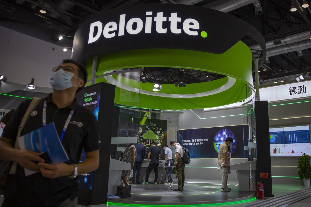 A visitor walks past a booth from accounting firm Deloitte at the China International Fair for Trade in Services (CIFTIS) in Beijing, Saturday, Sept. 5, 2020. Photo AP