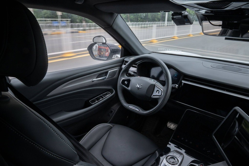A Baidu Apollo RT6 robotaxi travels on a road during on May 15, 2024. Baidu’s shares surged 10 per cent to HK$95.30 on media reports that the capital city of Beijing will support inclusion of robotaxis in ride-hailing services. Photo: Bloomberg