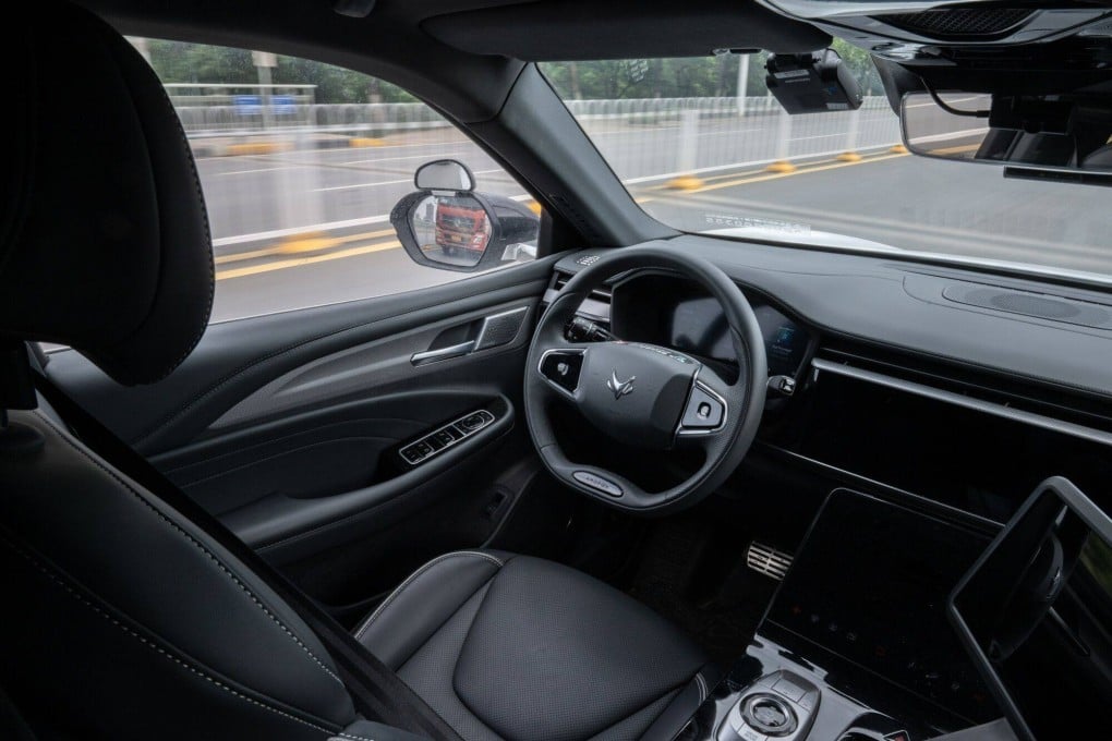A Baidu Apollo RT6 robotaxi travels on a road during on May 15, 2024. Baidu’s shares surged 10 per cent to HK$95.30 on media reports that the capital city of Beijing will support inclusion of robotaxis in ride-hailing services. Photo: Bloomberg
