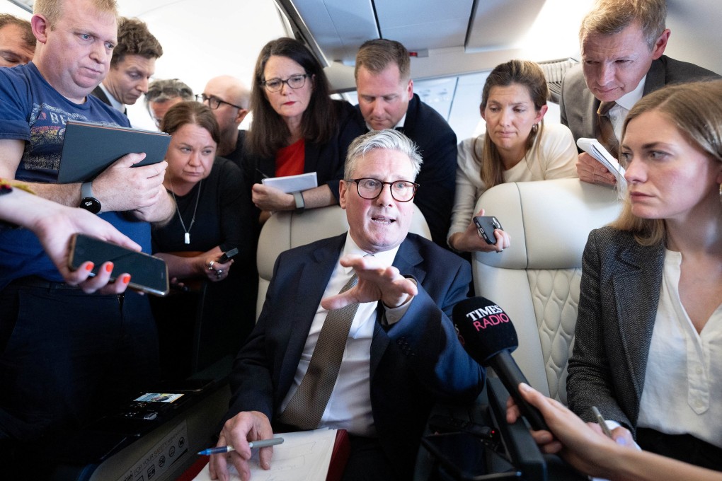 Britain’s Prime Minister Keir Starmer talks to journalists as he travels onboard a plane to Washington to attend a Nato summit on Tuesday. Photo: Pool via Reuters