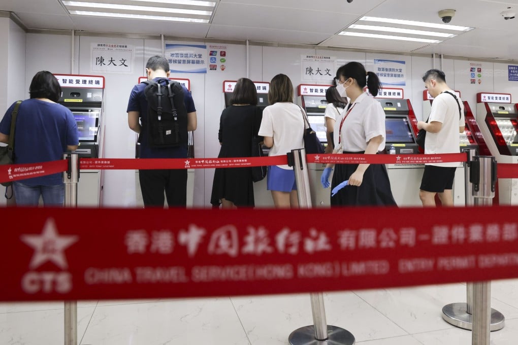 Hongkongers apply for a home visit permit at the China Travel Service Mong Kok Entry Permit Service Centre on July 2. A new scheme now allows non-Chinese permanent residents in Hong Kong and Macau to apply for visa-free travel permits to the mainland. Photo: Jelly Tse