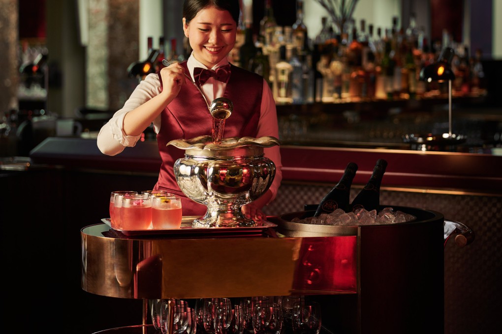 A waitress serves punch at Republic in the Ritz-Carlton Millenia Singapore, the highest ranked among eight Singapore bars on the Asia’s 50 Best Bars 2024 long list of bars ranked from 51 to 100. Photo: Ritz-Carlton Millenia Singapore