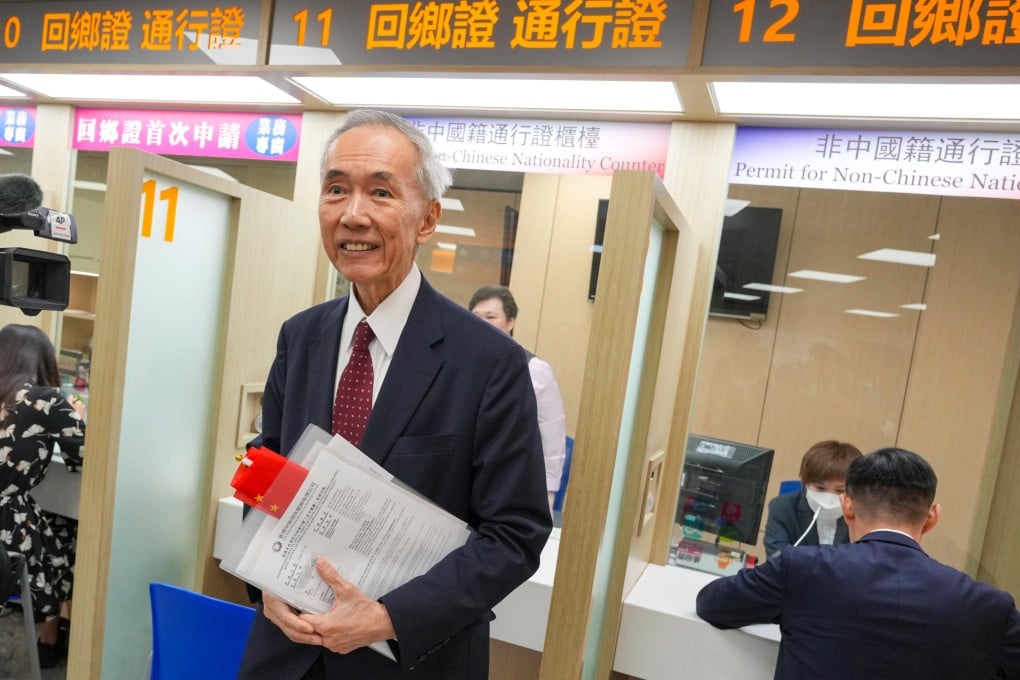 Sino Group chairman Robert Ng applies for the new mainland China travel permit on Wednesday. Photo: May Tse