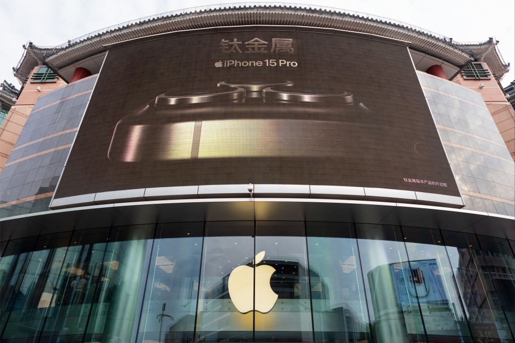 An iPhone 15 Pro ad is displayed on a large screen above an Apple flagship store in Beijing. Photo: Shutterstock Images