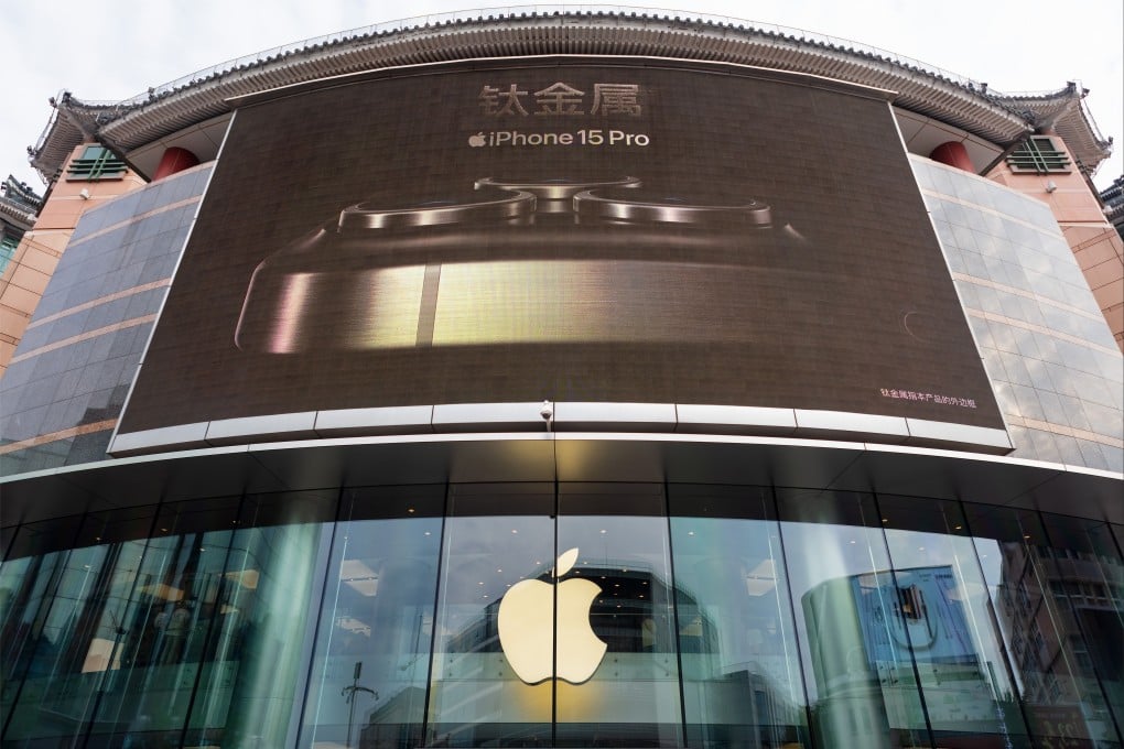 An iPhone 15 Pro ad is displayed on a large screen above an Apple flagship store in Beijing. Photo: Shutterstock Images