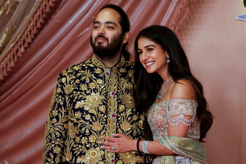 Anant Ambani with his fiancée Radhika Merchant during a ceremony in Mumbai on July 5. Photo: Reuters