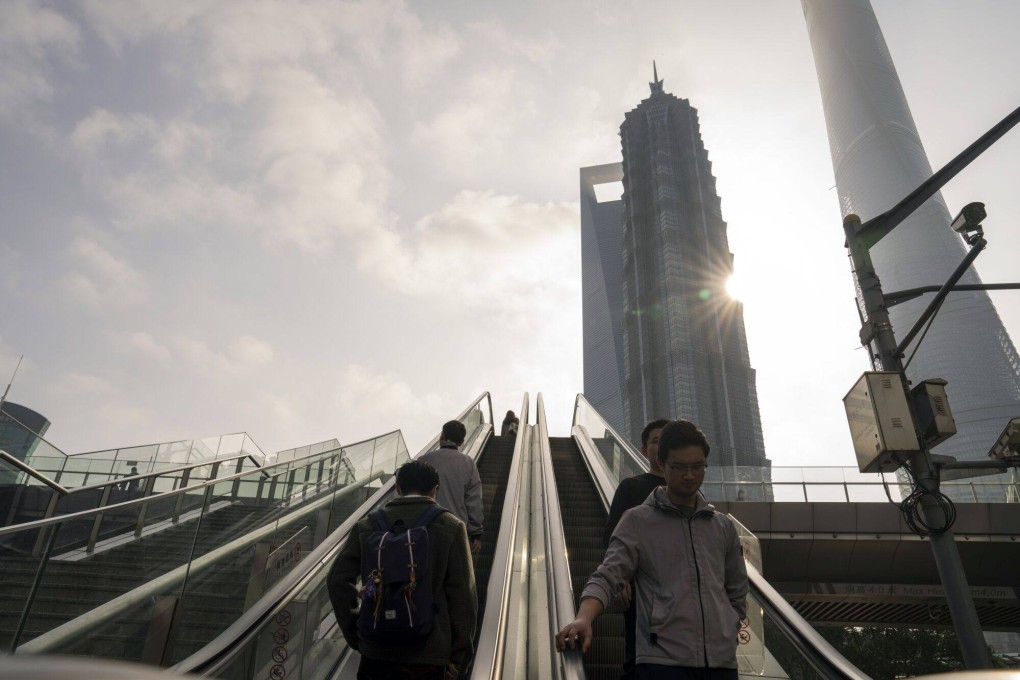 Pedestrians ride escalators in Pudong’s Lujiazui Financial District in Shanghai, China, on Monday, Jan. 29, 2024.The China Securities Regulatory Commission (CSRC) said on Wednesday night that it would raise the margin ratio for short-selling and pledged more scrutiny for quant-based investments. Photographer: Photo: Bloomberg