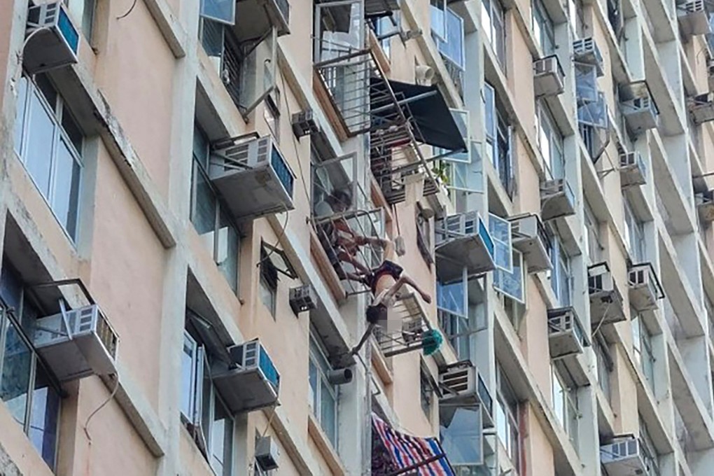 A 77-year-old man hung from his foot after falling while hanging laundry in Tsui Ping North Estate, Kwun Tong. Photo: Handout