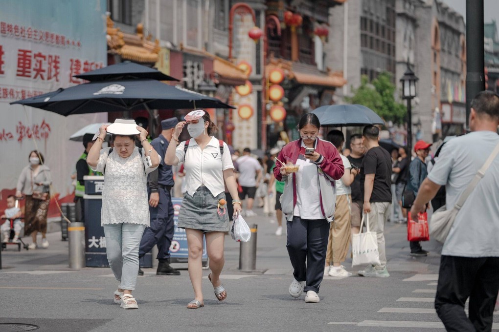 Pedestrians in Beijing. Photo: Bloomberg