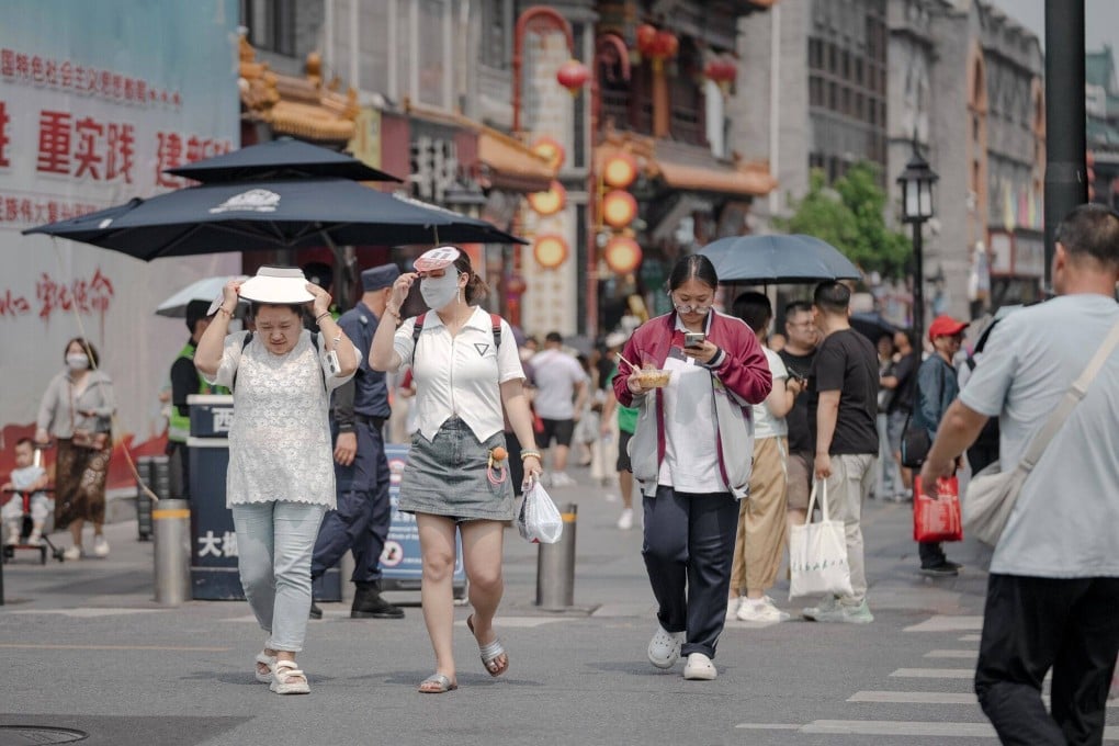 Pedestrians in Beijing. Photo: Bloomberg