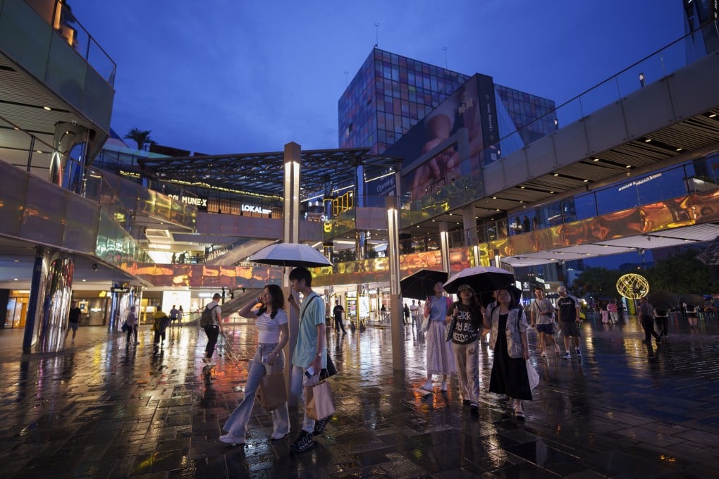People shop at Taikoo Li Sanlitun shopping centre in Beijing on July 2, 2024. Photo: AP