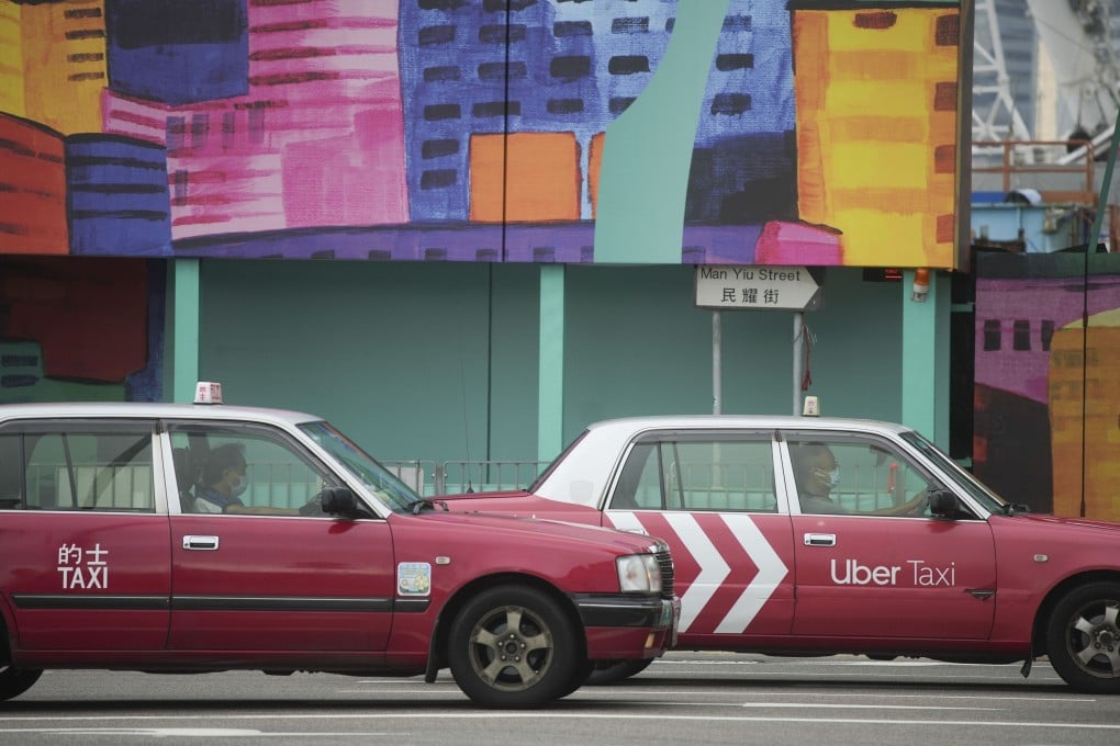 A taxi overtakes another near a construction site in Central on May 30. Photo: Sun Yeung