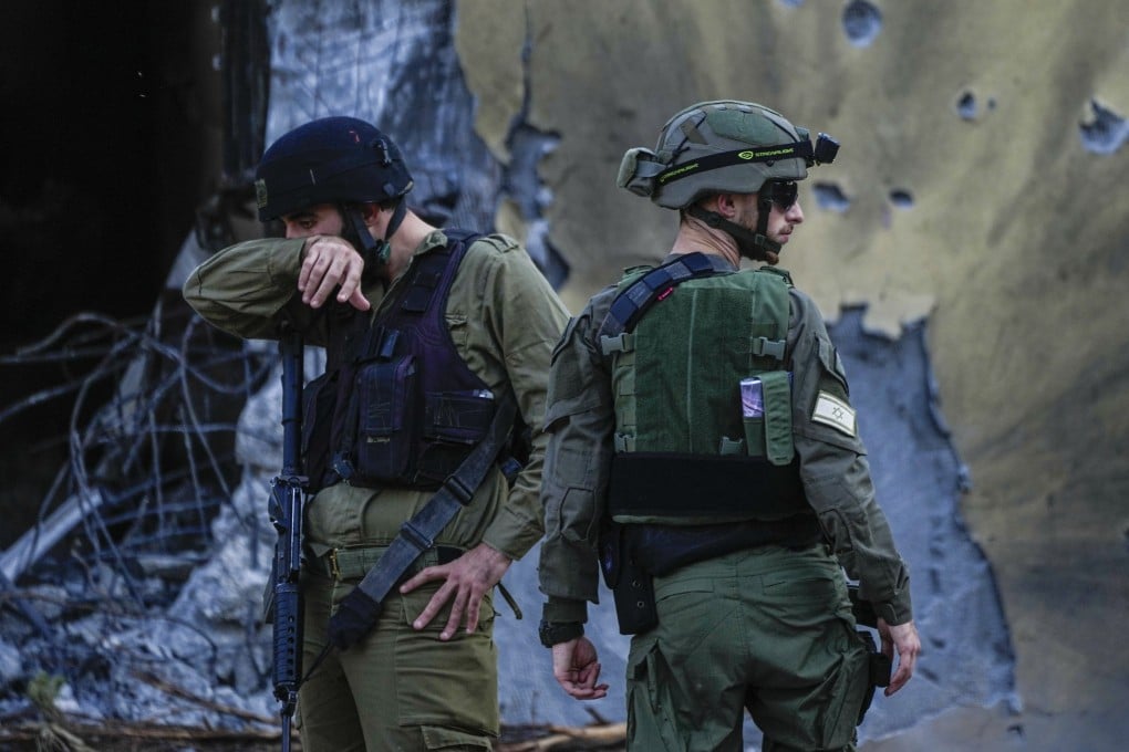 Israeli soldiers at Kibbutz Be’eri, a week after the October 7 attack. File photo: AP