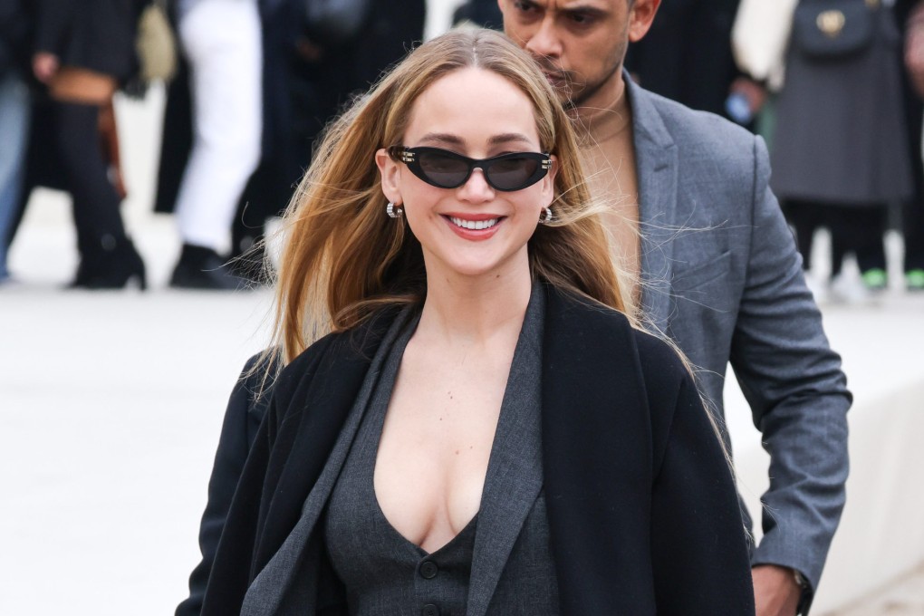 Jennifer Lawrence attends the Christian Dior womenswear autumn/winter 2024-25 show at Paris Fashion Week on February 27, 2024, showing off the “corporate sleaze” look that has become a viral TikTok trend. Photo: Getty Images