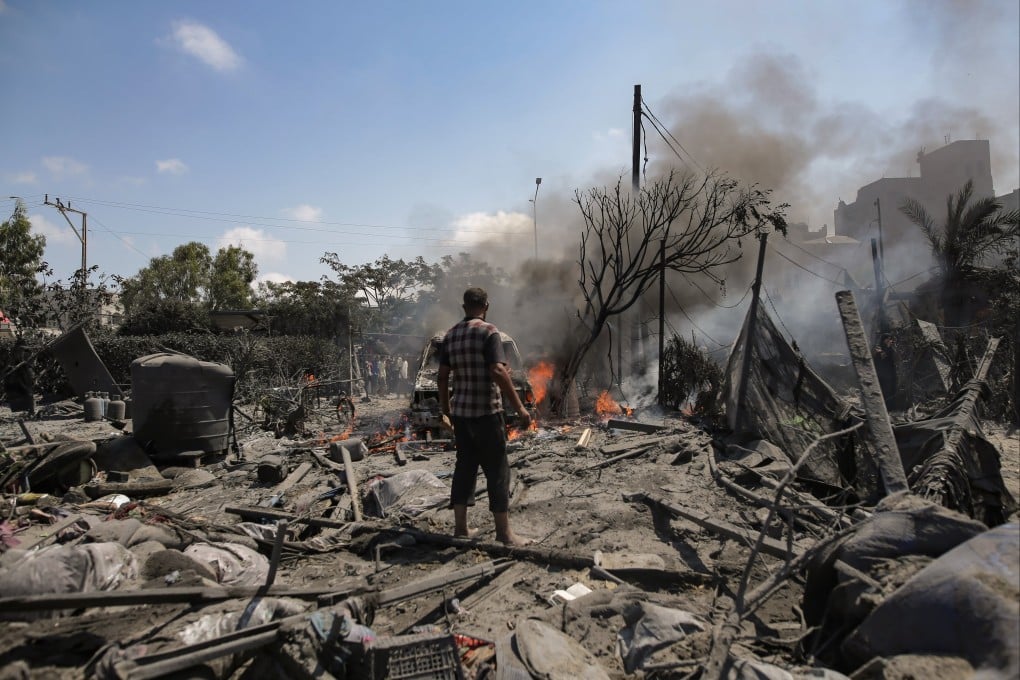 Palestinians inspect the scene after an Israeli raid on the tents of displaced people in the Al-Mawasi area of Khan Younis in the southern Gaza Strip on Saturday. Photo: EPA-EFE