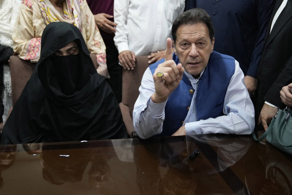 Pakistan’s former prime minister Imran Khan and his wife Bushra Bibi, his wife at an office of Lahore High Court in Lahore, Pakistan, in July 2023. Photo: AP